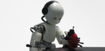 Robot "child" grasping an object